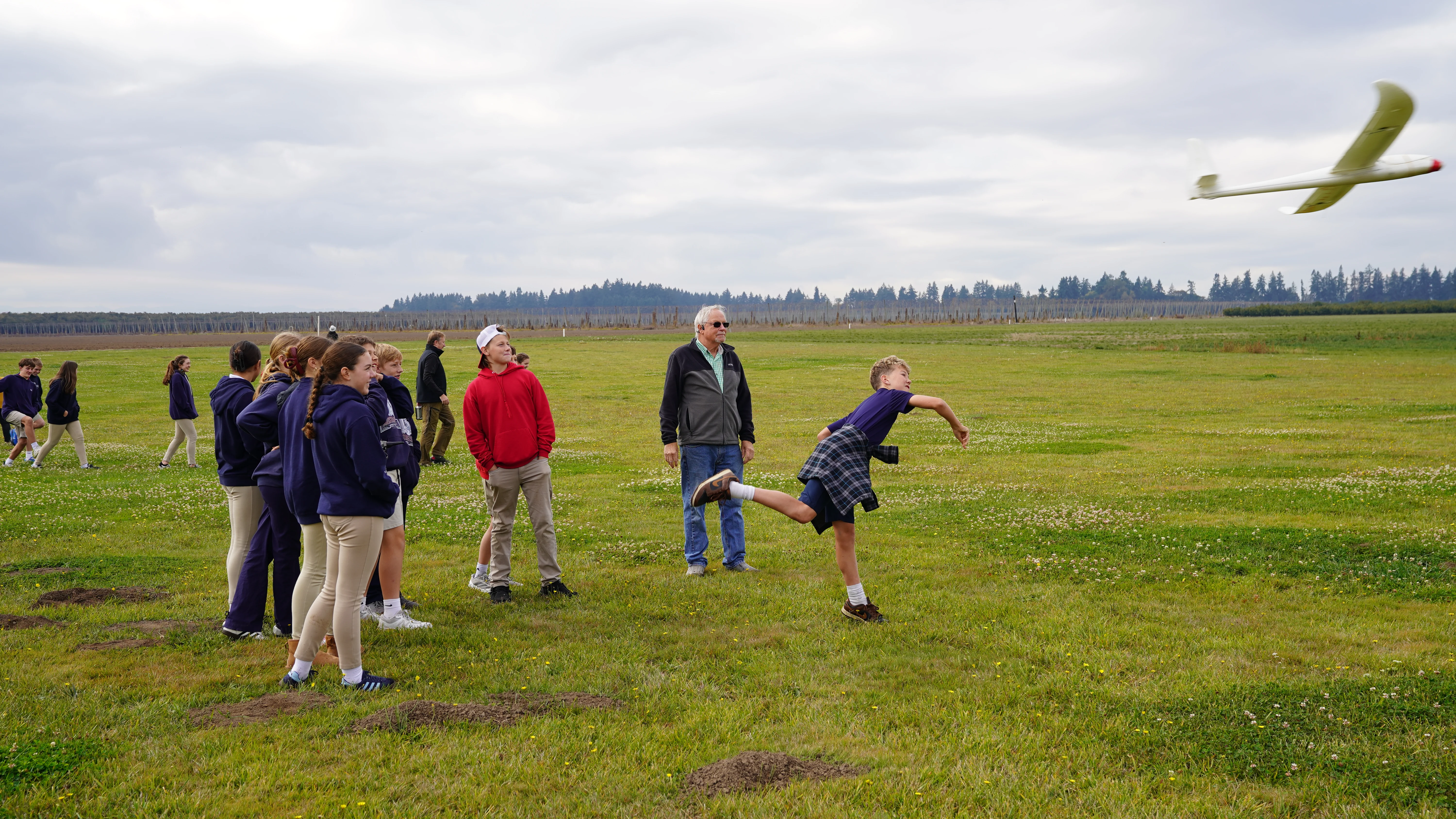 Student throwing a glider